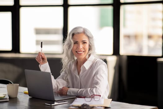 Successful Manager Woman Sitting Near Laptop Posing At Workplace
