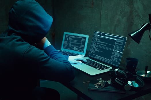 Close up of programmer of hacker hands typing a code
