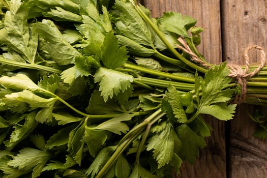 Overhead close-up of fresh parsley on wooden table