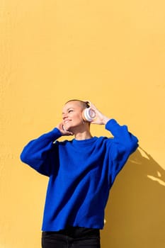 woman enjoying happy the music in her headphones