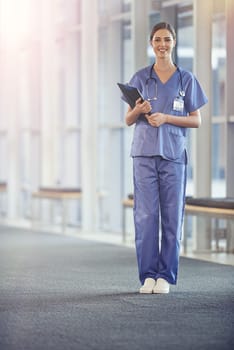 Female nurse, portrait and stethoscope with chart at the hospital for results or details for surgeon. Clipboard, nursing and healthcare at a medical centre with smile in the hallway with notes.