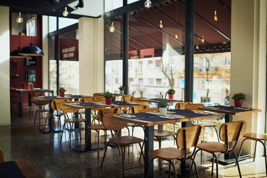 Empty restaurant cafe, deli or store for retail services, hospitality industry or sales service. Interior design decor, breakfast coffee shop and trendy small business with furniture, chair and table
