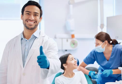 Consulting, thumbs up and portrait of dentist with patient for teeth whitening, service and dental care. Healthcare, dentistry and hand sign of orthodontist for oral hygiene, wellness and cleaning