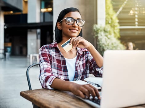 Happy woman, student and thinking on laptop with credit card for ecommerce, payment or campus loan. Female person or university learner in thought on computer for online shopping, debit or banking