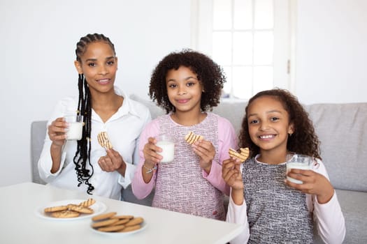Black Family Having Lunch Together At Home, Smiling To Camera