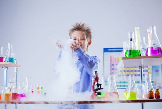 Curious boy watches chemical reaction of reagent