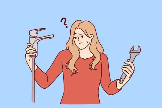 Woman with water faucet and wrench does not understand how to fix water supply or get rid of leak