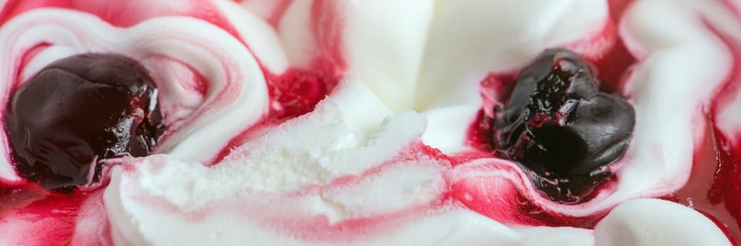 Texture of cherry ice cream. Fresh and delicious ice cream with cherries is a tasty treat for children and adults.