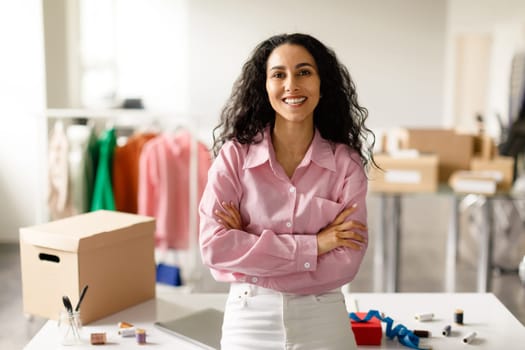 Successful Clothing Designer Woman Posing Standing In Showroom