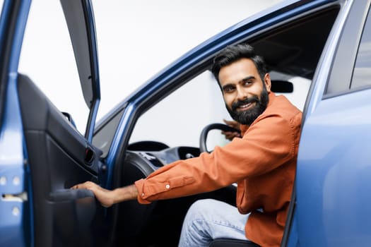 Happy Arabic Man Opening Automobile Door Sitting In New Vehicle