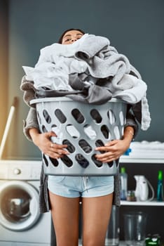 Clothes, laundry and woman with basket in her home for housework, washing and hygiene. House, cleaning and female carrying fresh fabric for spring clean, tidy and household task on the weekend