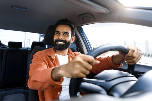 Smiling Bearded Indian Man Driving Auto Sitting In Driver's Seat