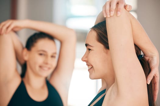 Fitness, stretching and women in studio for exercise, training or warm up on blurred background. Friends, stretch and pilates workout in gym for cardio, flexible or healthy lifestyle, happy and relax.