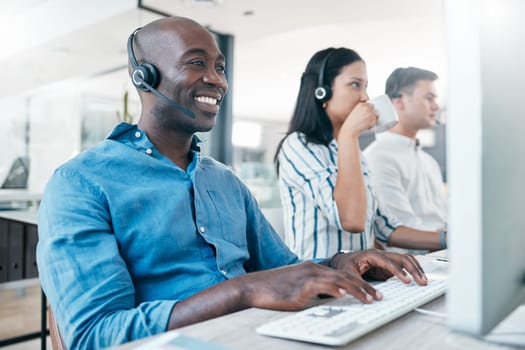 Call center, computer and team online for customer service, crm and telemarketing in office. Black man and woman consultant at pc with data analysis for sales, contact us and online support or advice