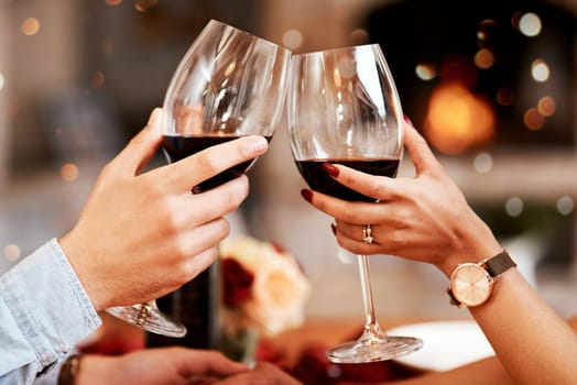 Red wine, glass and couple hands toast, celebrate or cheers in 5 star restaurant or fine dining alcohol store. Romance love, marriage anniversary or people on Valentines Day date for holiday event