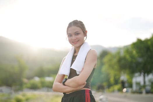 Portrait, young woman outdoor, exercise or fitness for wellness, health or smile. Asian female, girl and athlete rest, nature and workout for training, sports or practice to relax