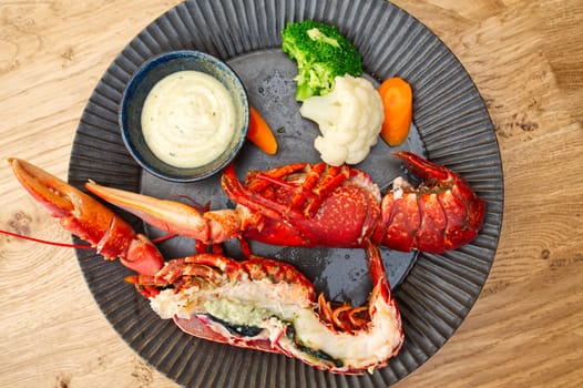 Cooked fresh lobster. Red lobster dinner seafood. Gourmet food healthy boiled lobster