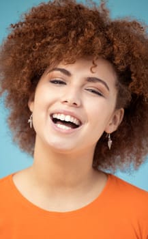 Portrait, black woman and smile for achievement, celebration and confident girl on blue studio background. Face, happy African American female and lady with happiness, joyful or cheerful with success.