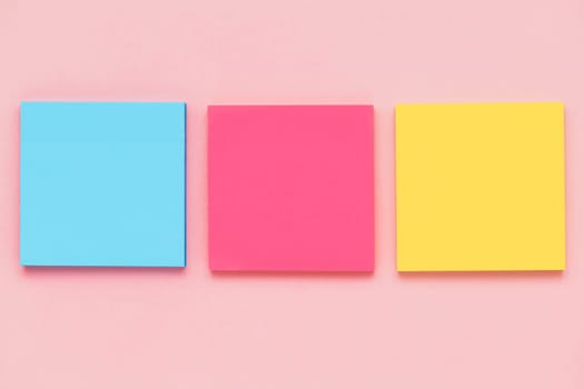 Sticky paper notes on pink background for office and school stationary concept
