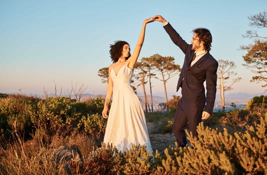 Love, wedding and holding hands for dance with couple in nature park for celebration, romance and happiness. Sunset, support and summer with bride and groom for marriage, ceremony and bonding.