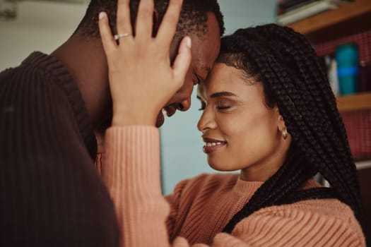 Black couple, love and care while together for happiness in a happy marriage with commitment and care. Young man and woman touching face of head while in a house to bond, intimate and show commitment