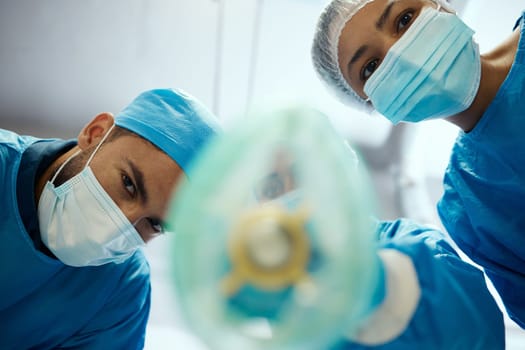 Health, surgeon and anesthesia, doctors and surgery with medical and cardiovascular healthcare, face mask and low angle view. Medicine, operation and health care team, cardiology and hospital.