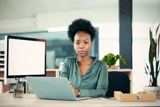 Portrait, serious and black woman with laptop, writer and creative in office workplace. Computer, face and female entrepreneur, copywriter and professional from South Africa with business mockup.