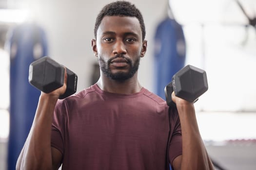 Black man, portrait and dumbbell workout in gym for strong power, wellness exercise and serious mindset. Bodybuilder, fitness and male training with weights for health, sports energy or muscle growth