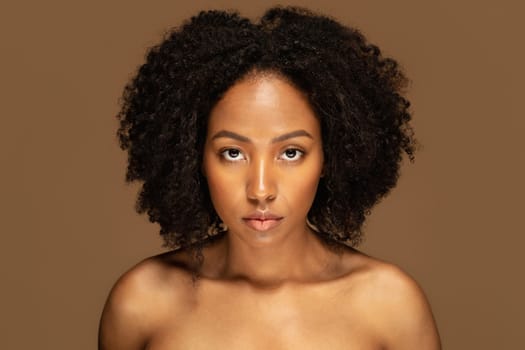 Portrait of sensual attractive young black woman on background