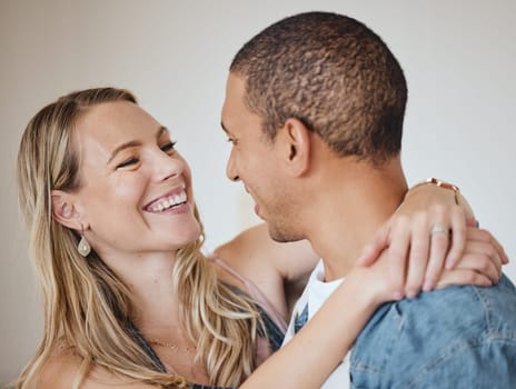 Love, hug and smile with a diversity couple in studio on a gray background for romance or affection. Trust, safe and together with a man and woman hugging while bonding, dating or loving.