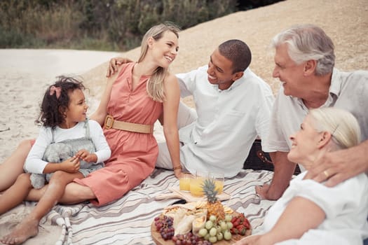Interracial couple, girl or family picnic on beach with parents, children or grandparents by sea or ocean in Hawaii. Smile, happy or comic men, women or kids bonding in relax nature reunion with food