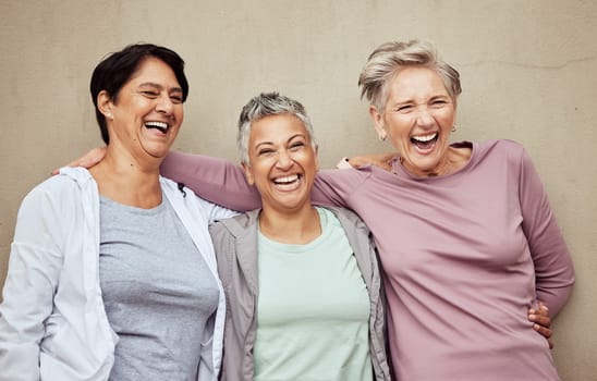 Senior women, group and laughing for fitness, workout or happiness of healthy lifestyle together. Mature female friends relax after training, wellness and funny retirement exercise on wall background.