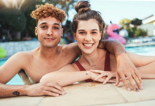 Party, swimming and portrait with a couple of friends in the pool outdoor together during summer. Love, water and diversity with a young man and woman swimmer enjoying a birthday or celebration event.