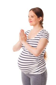 Pregnant woman doing yoga asana asana Tadasana namaste - Mountain pose with salutation