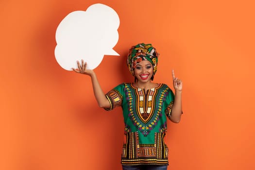 Inspired lack woman in african costume with blank conversation bubble