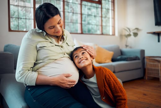 Pregnancy, family and girl with pregnant mother listening to newborn baby with love, affection and bonding. Family home, maternity and mom on sofa with child with ear to pregnant belly in living room
