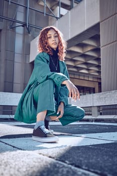 Trendy, style and cool teenage girl portrait in an urban city alone. Fashion, street style and young woman on an edgy day outside. Town, clothing and fashionable lady in summer
