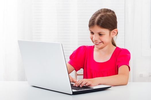 Little girl  using laptop