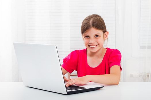 Little girl  using laptop