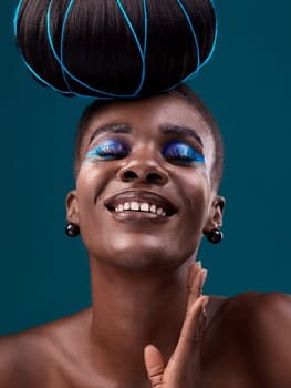 Happy, hair and cosmetics with a model black woman in studio on a blue background for beauty. smile, haircare and makeup with an attractive young female person at the salon for fashion or styling