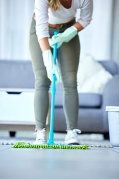 Mop, cleaner and woman cleaning floor with disinfection and hygiene with housekeeping service. Maintenance, professional maid and female housekeeper, fresh clean tiles and bacteria disinfection