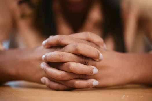 Hands, pray and trust with a black woman asking god for help while praying alone in her home closeup. Worship, prayer and religion with a female praying for forgiveness in spiritual faith or belief