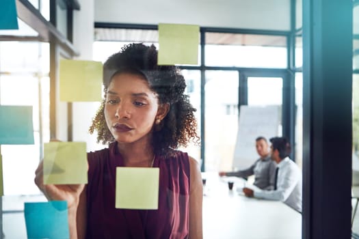 Thinking, strategy or black woman for business schedule planning, creative idea or marketing review in meeting. Corporate, glass post it sticky note or manager for analytics or project management