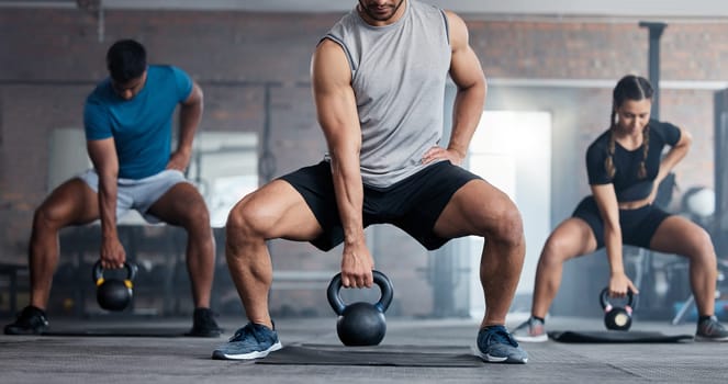 Fitness, weightlifting and kettlebell class for arm workout, exercise or training together at the gym. Active people in sports exercising with kettle weights for healthy cardio endurance or wellness