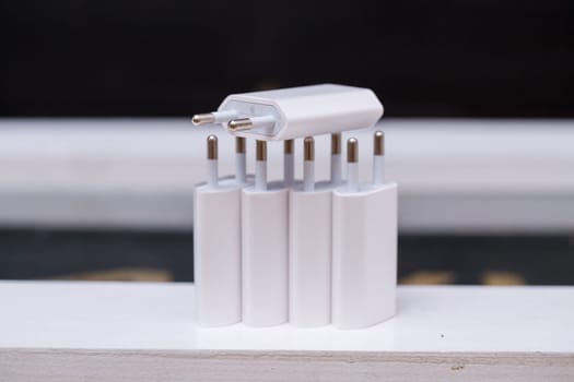 Chargers blocks for charging the phone in white.