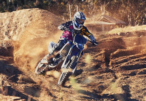 Time to rip up this track. a professional motocross rider in action.
