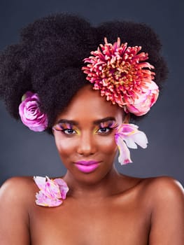 Art, flowers and portrait of black woman in studio for beauty, creative and spring. Natural, cosmetics and floral with african model isolated on dark background for makeup, self love or confidence