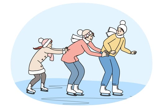 Family skating on ice rink together