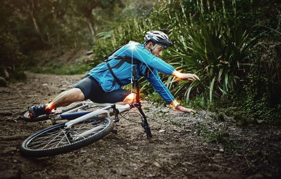 Man, mountain bike and woods with falling, ground and fitness for training, workout and red glow for injury. Forest cycling, guy and joint pain with bicycle, accident and riding outdoor in nature
