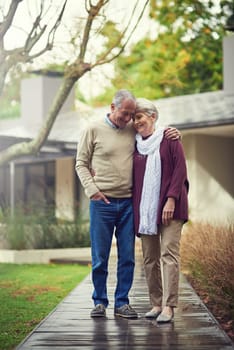 Happy senior couple, garden and hug with smile, walk and together with love, bonding or freedom in winter. Old woman, man and embrace with care in backyard in retirement, nature or outdoor in morning